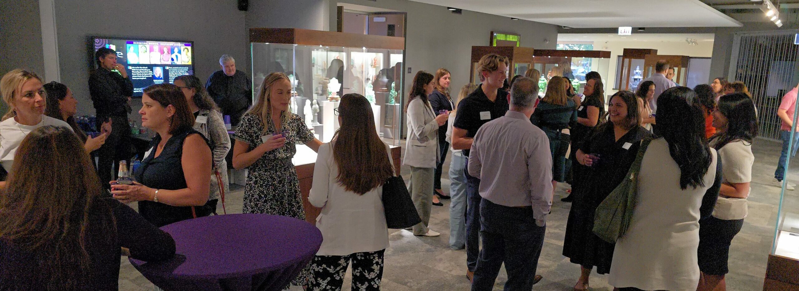 People mingling at an event hosted at the Lizzadro Museum of Lapidary Art